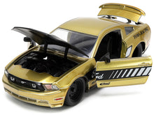 Load image into Gallery viewer, 2010 Ford Mustang GT Gold Metallic with Black Graphics and Hood &quot;Tom&#39;s Racing&quot; &quot;Bigtime Muscle&quot; Series 1/24 Diecast Model Car by Jada Jada
