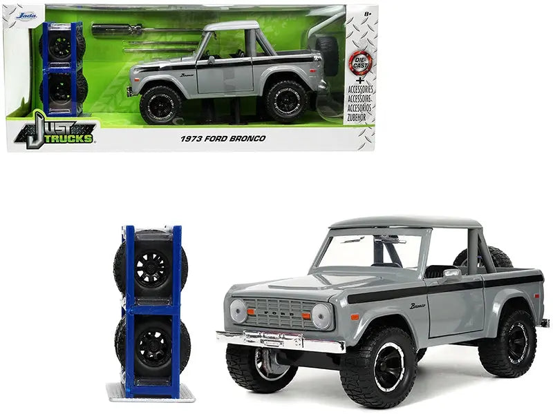 1973 Ford Bronco Pickup Truck Gray with Black Stripes with Extra Wheels "Just Trucks" Series 1/24 Diecast Model Car by Jada Jada