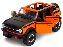 Load image into Gallery viewer, 2021 Ford Bronco Open-Top Orange with Black Stripes and Hood with Extra Wheels &quot;Just Trucks&quot; Series 1/24 Diecast Model Car by Jada Jada
