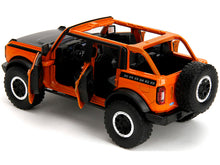 Load image into Gallery viewer, 2021 Ford Bronco Open-Top Orange with Black Stripes and Hood with Extra Wheels &quot;Just Trucks&quot; Series 1/24 Diecast Model Car by Jada Jada
