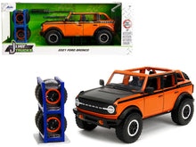 Load image into Gallery viewer, 2021 Ford Bronco Open-Top Orange with Black Stripes and Hood with Extra Wheels &quot;Just Trucks&quot; Series 1/24 Diecast Model Car by Jada Jada
