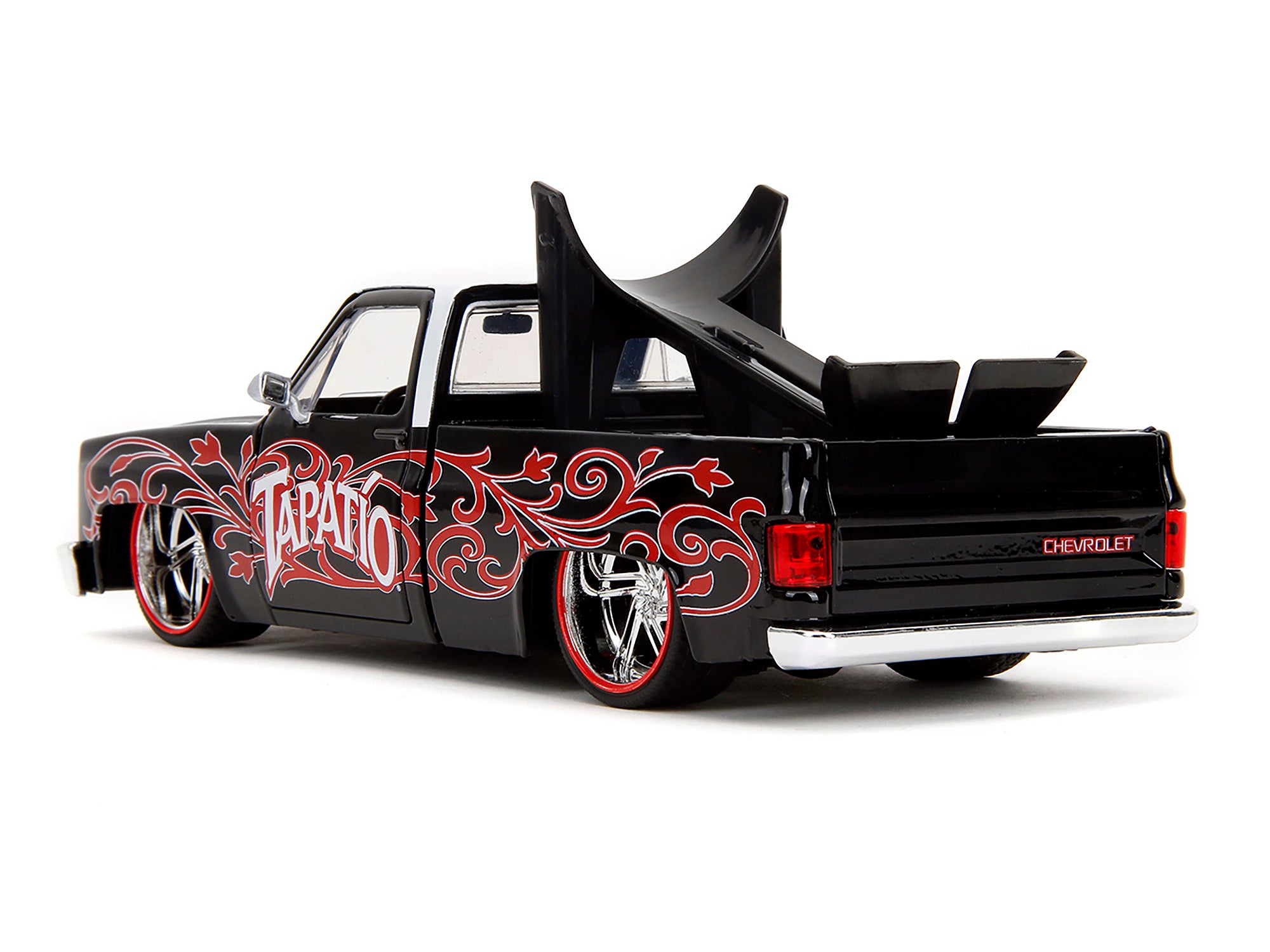 1985 Chevrolet C-10 Pickup Truck Black with White Top and Graphics with Charro Man Diecast Figure "Tapatio" 1/24 Diecast Model Car by Jada Jada