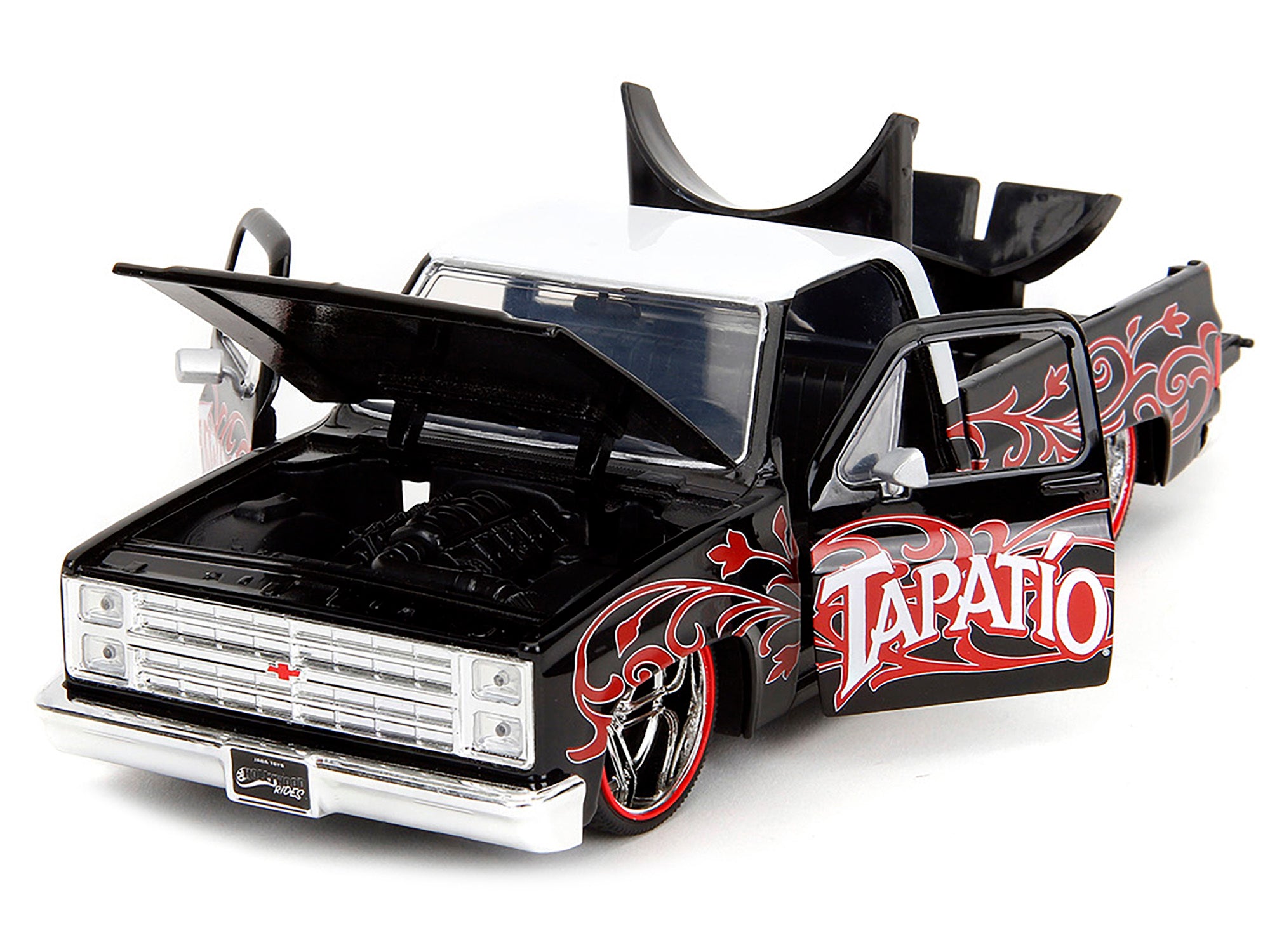 1985 Chevrolet C-10 Pickup Truck Black with White Top and Graphics with Charro Man Diecast Figure "Tapatio" 1/24 Diecast Model Car by Jada Jada