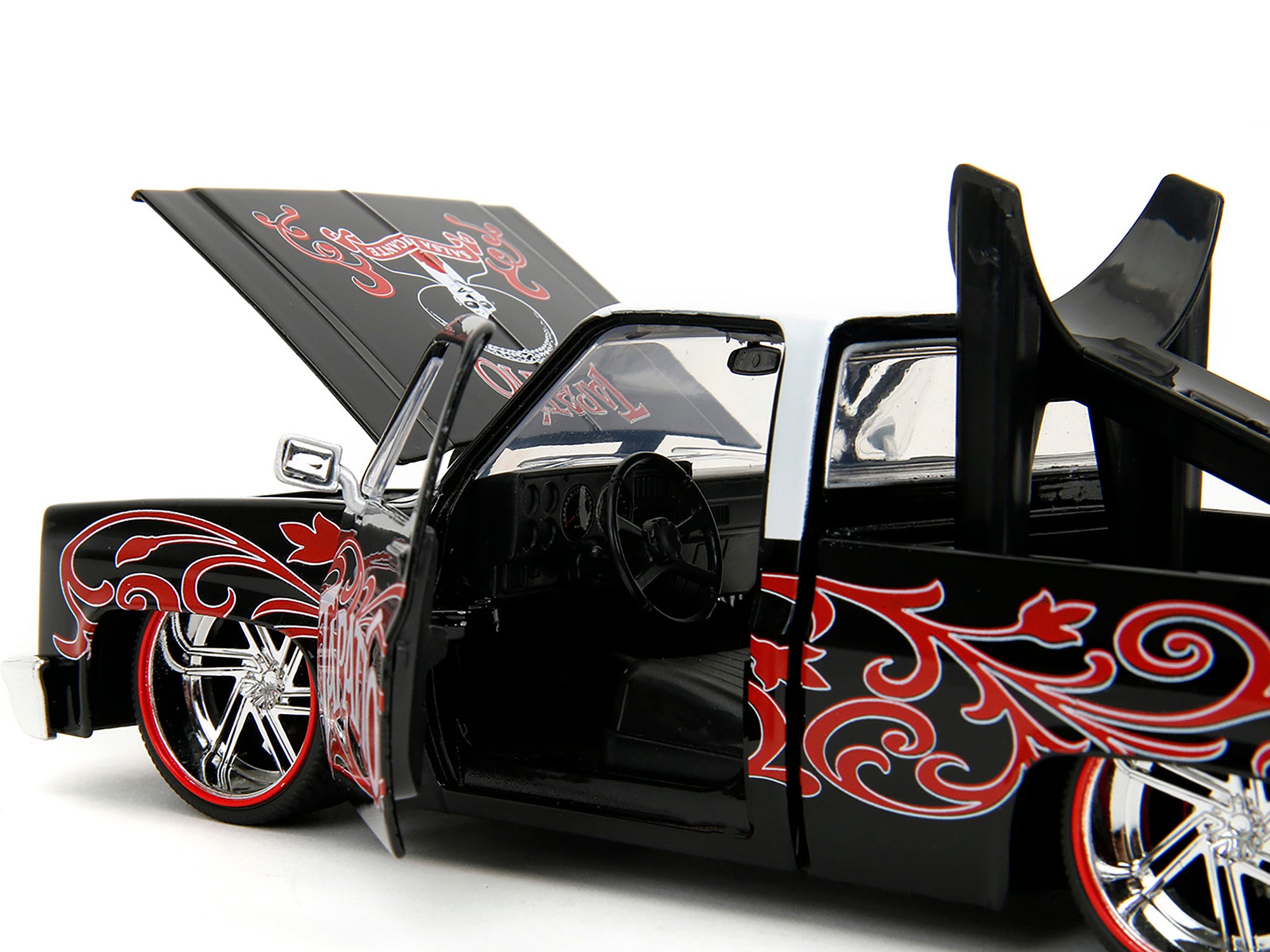 1985 Chevrolet C-10 Pickup Truck Black with White Top and Graphics with Charro Man Diecast Figure "Tapatio" 1/24 Diecast Model Car by Jada Jada