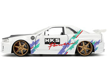 Load image into Gallery viewer, 2002 Nissan Skyline GT-R (R34) RHD (Right Hand Drive) &quot;HKS Power&quot; White with Carbon Hood and Graphics &quot;JDM Tuners&quot; Series 1/24 Diecast Model Car by Jada Jada
