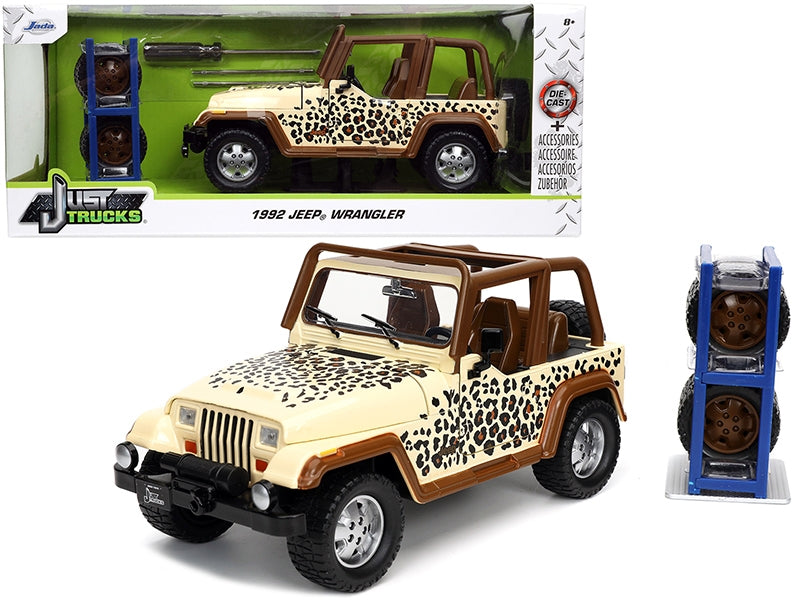 1992 Jeep Wrangler Tan and Brown with Graphics and Extra Wheels "Just Trucks" Series 1/24 Diecast Model Car by Jada Jada