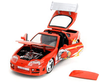 Load image into Gallery viewer, 1995 Toyota Supra Red with Graphics and Saitama Diecast Figure &quot;One Punch Man&quot; (2015-2019) TV Series 1/24 Diecast Model by Jada Jada
